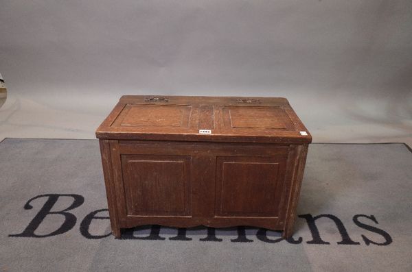 A 17th century style oak coffer, of raised and fielded panelled construction, 59cm wide x 39cm high.