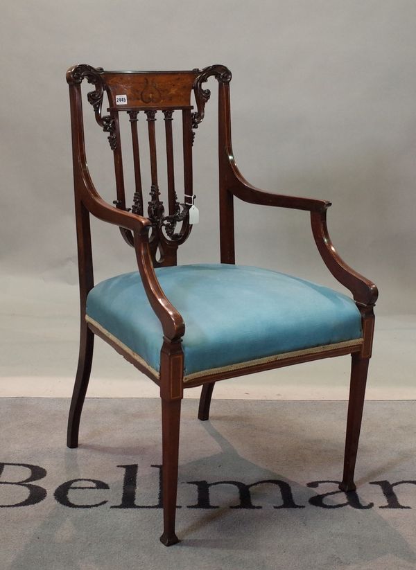An Edwardian carved mahogany boxwood strung and foliate inlaid salon elbow chair, on square tapered legs, 51cm wide x 99cm high.