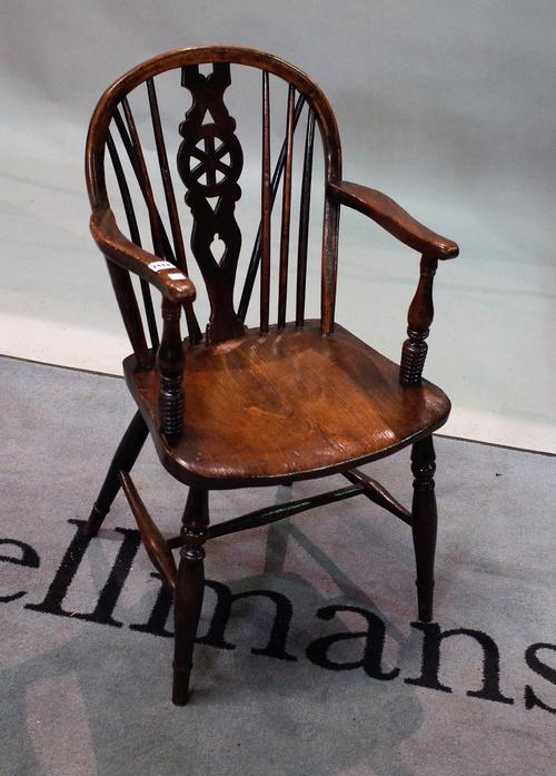 An 19th century and later ash and elm wheelback open armchair on turned supports, 48cm wide x 82cm high.