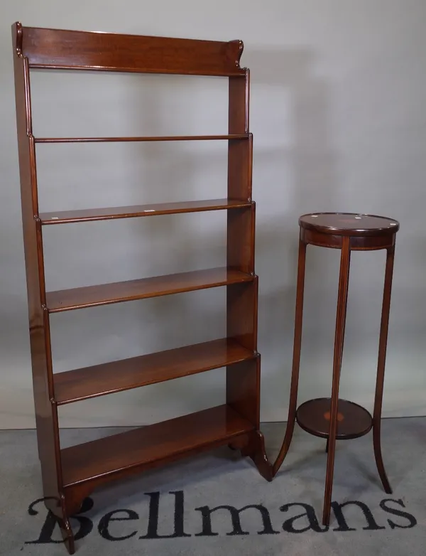A modern mahogany six tier waterfall open bookcase, 74cm wide x 154cm high, and an Edwardian inlaid mahogany jardiniere stand, 32cm diameter x 97cm...