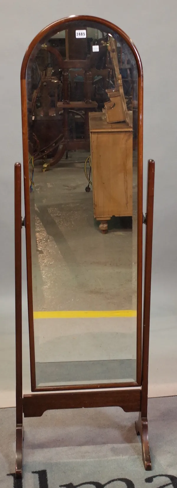 An early 20th century mahogany arch top cheval mirror with bevelled glass, 45cm wide x 140cm high.