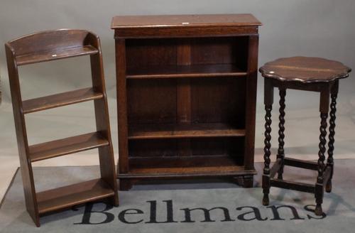A oak three tier open bookcase, 76cm wide x 91cm high, a four tier waterfall open bookcase, 43cm wide x 92cm high, and a late Victorian oak side...