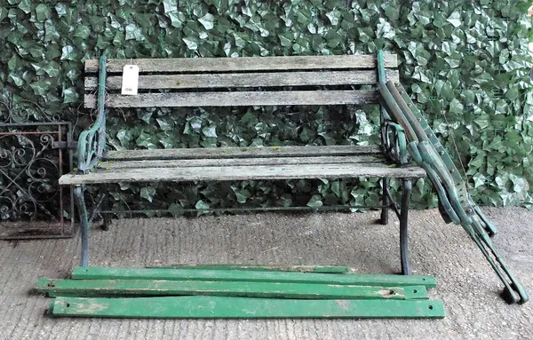 A black painted aluminium garden bench with wooden slats, 123cm wide x 69cm high, together with a small wrought iron gate, 48cm wide, and a pair of...