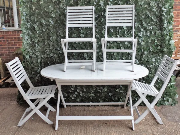 A white painted oval garden table on folding 'X' frame base, 150cm wide, with six folding chairs, (7).