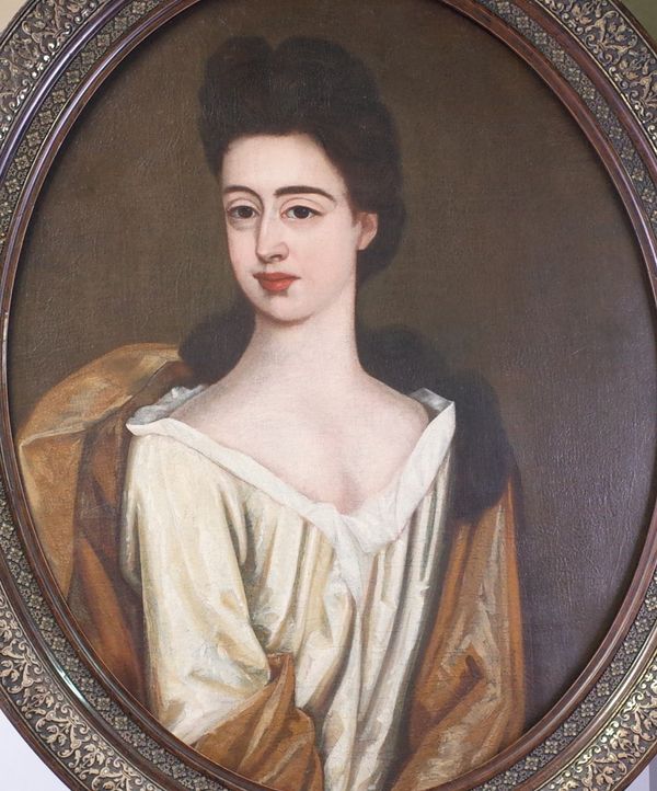 Follower of Godfrey Kneller, Portrait of a lady, oil on canvas, 71 x 56cm