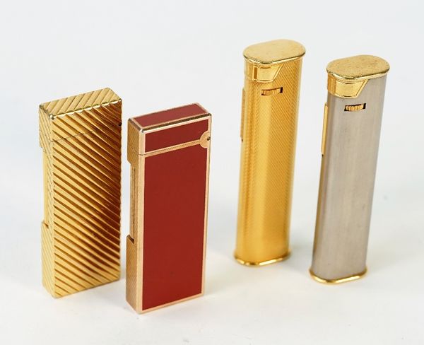 Four Dunhill lighters, including a rose gold plated and red lacquer example and a gold plated diagonal fluted example, (4).