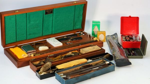 A large quantity of gun cleaning rods, mainly 12 gauge, together with an assortment of brush heads, a Lightwood & Son Ltd mahogany cased gun cleaning...