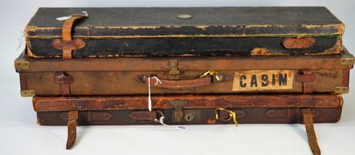 Stephen Grant & Joseph Lang Ltd, a leather shotgun travelling case, 82cm wide, together with two further leather and canvas examples by Westley...