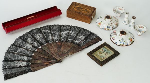 A black lace fan, late 19th century, with pierced and carved mother-of-pearl stick, 52cm across, in red silver covered Duvelleroy Paris case, a...