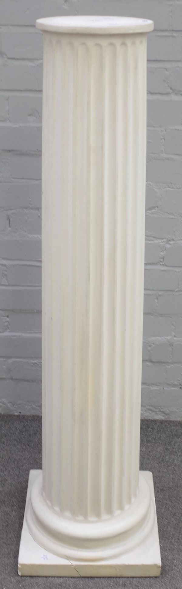 A white painted plaster fluted column, 120cm high.