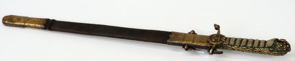 WITHDRAWN - A Victorian 1856 pattern naval midshipman's dirk, with lion's head pommel, crowned fouled anchor and leather scabbard, blade 17 3/4 in,...