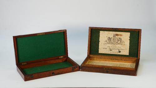 An oak duelling pistol case, the interior with paper label detailed 'John Blanch & Son', together with another similar mahogany example, 37cm wide...