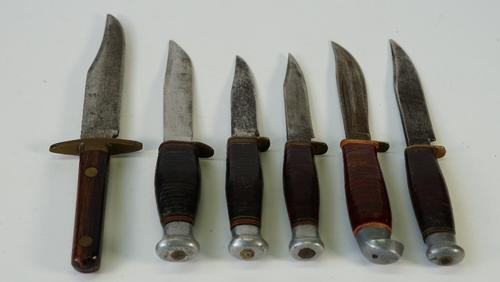 Six early 20th century steel bladed hunting knives, to include an example by H.M Slater, length of largest 25cm, (6).