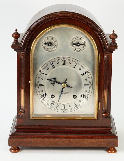 A George III style mahogany bracket clock, Winterhaler & Hofmeier, circa 1900, retailed by T Braybrook, Dorchester, with arched top case, silvered...