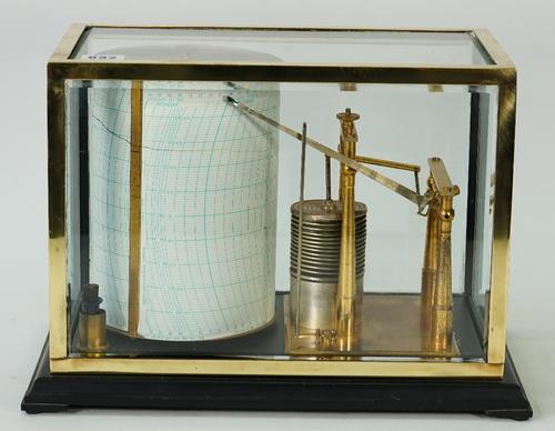A Short & Mason 'Tycos' barograph, number 20/29, in a glazed brass case, height of drum 20cm, with a box containing charts and spare ink.