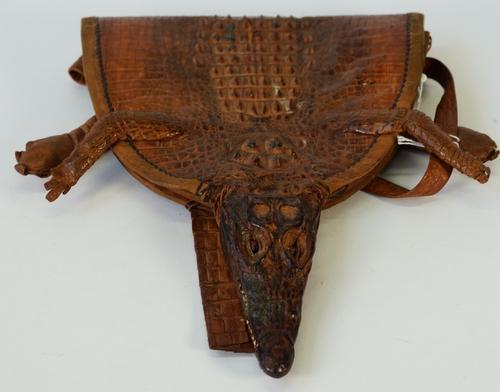 A shoulder bag made from a complete cayman, cured to include head and feet, fully leather lined, full length 54cm.