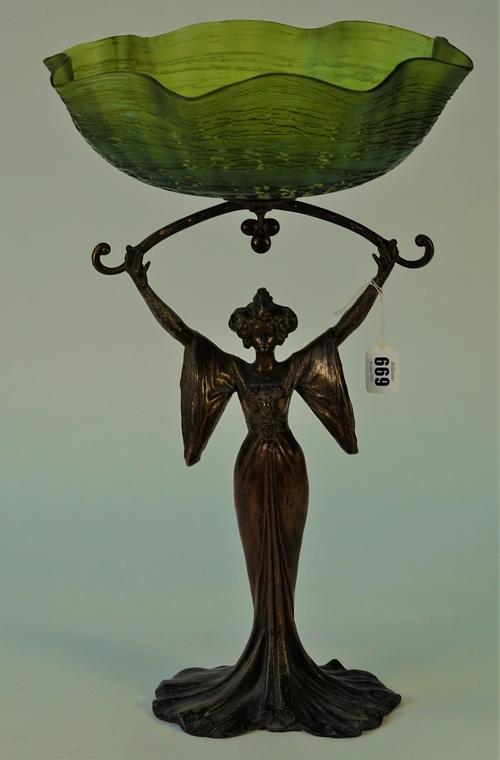 After Louis Auguste Moreau, a French Art Nouveau patinated spelter figure and green glass centrepiece bowl, detailed 'Aug.Moreau', 47.5cm high.