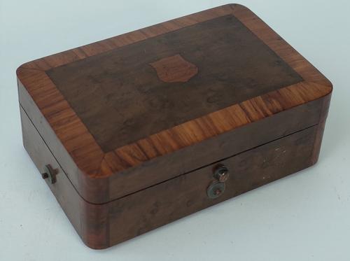 A Swiss burr wood music box, late 19th century, playing two airs, on a three inch brass roller, 12.5cm wide, (key).