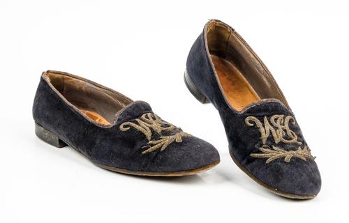 Sir Winston Churchill's monogrammed midnight blue velvet evening slippers, 1950s, of Albert style, embroidered in raised gold thread with the...