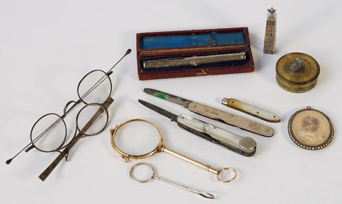 A Victorian novelty propelling pencil formed in the style of Cleopatra's needle, length 5cm, a pair of Georgian spectacles and a broken silver...