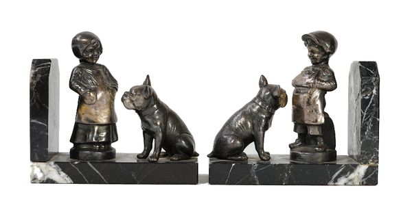 A pair of silver plated and marble book-ends, mounted with models of a child and a bulldog, each 15cm wide.