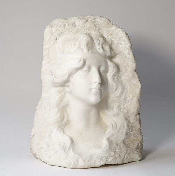 A carved white marble relief bust, modelled as a three quarter profile of a young maiden with flowing hair on a naturalistic background, inscribed...