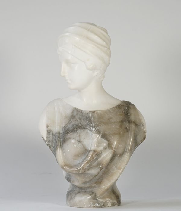 An alabaster bust of a young female wearing a turban, inscribed 'Pugi', 36cm high.