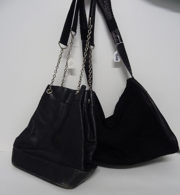 A Prada black suede and leather Hobo bag, with top zip and fabric lined interior 29cm x 40cm; and a Gianni Versace black leather drawstring handbag...