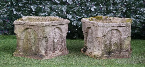 A pair of reconstituted stone pentagonal shaped garden planters, relief cast with figures in arches, 47cm wide x 31cm high.