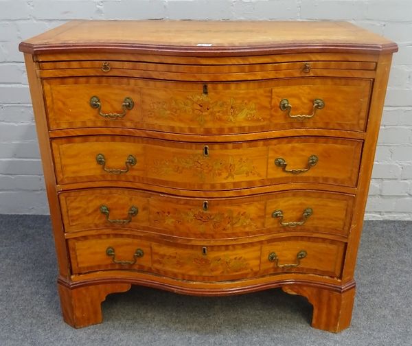 A George III style floral marquetry inlaid satinwood serpentine commode, the brushing slide over four long graduated drawers on bracket feet, 88cm...