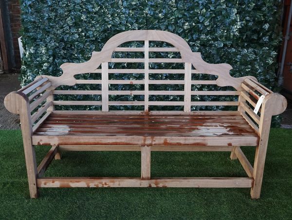 A Lutyens design teak framed hardwood garden bench, 165cm wide x 104cm high.