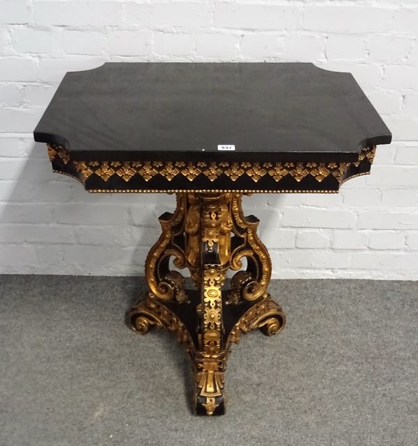 A Victorian parcel gilt ebonised centre table with re-entered cornered rectangular top on a trio of C-scroll supports, 71cm wide x 77cm high.