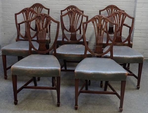 A set of eight George III mahogany shield back dining chairs, with Prince of Wales feather carved decoration, on tapering square supports, to include...