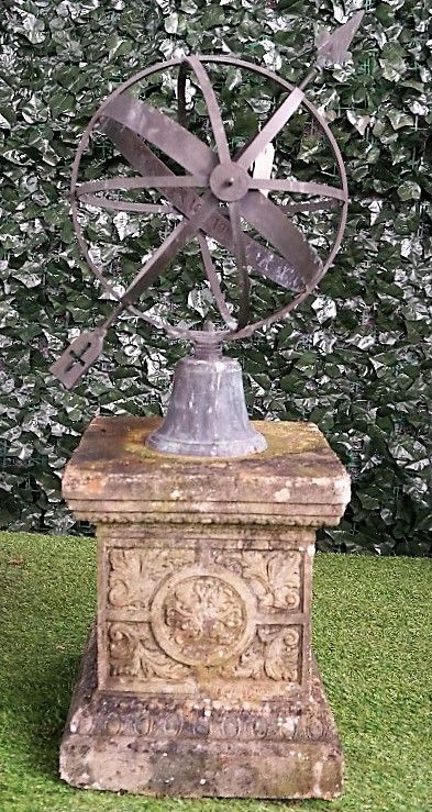 A copper armillary sphere on a stepped reconstituted stone pedestal, 100cm high.