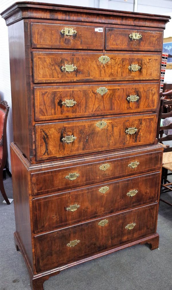 A George II featherbanded figured walnut chest on chest, with two short over six long graduated drawers, on bracket feet, 100cm wide x 172cm high.