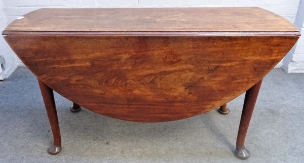 A George II mahogany oval drop flap table on pad feet, 137cm wide x 73cm high.