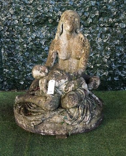 A 19th century English carved marble figure group of a seated mother and child, 97cm wide x 102cm high.