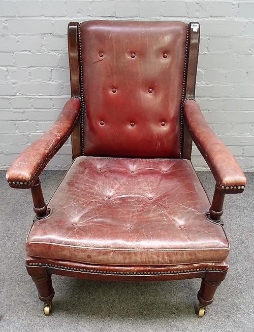 Maple & Co, a mahogany framed open armchair, in rouge leather upholstery on turned supports, back legs stamped MAPLE & CO and GR V, 68cm wide x 90cm...