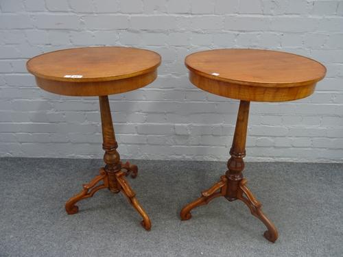 A pair of North European walnut circular occasional tables, on tripod bases, 49cm diameter x 78cm high, (2).