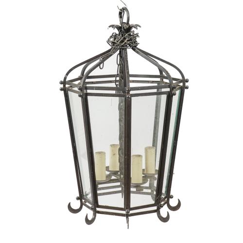 A BLACK PAINTED WROUGHT AND CAST IRON OCTAGONAL HALL LANTERN