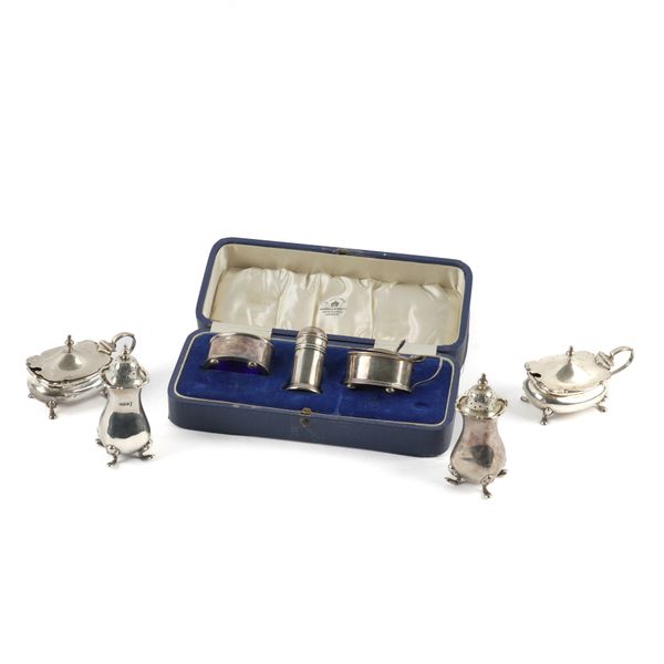 A SILVER THREE PIECE CONDIMENT SET AND FOUR FURTHER CONDIMENTS (5)