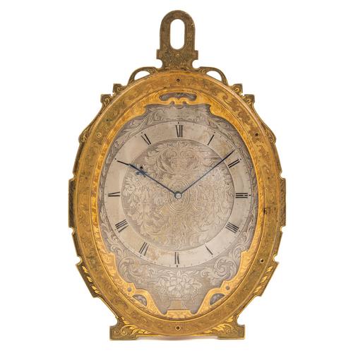 A GILT-BRASS OVAL STRUT TIMEPIECE