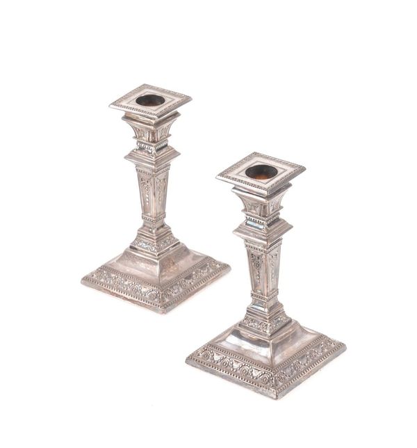 A VICTORIAN NEAR PAIR OF SILVER TABLE CANDLESTICKS