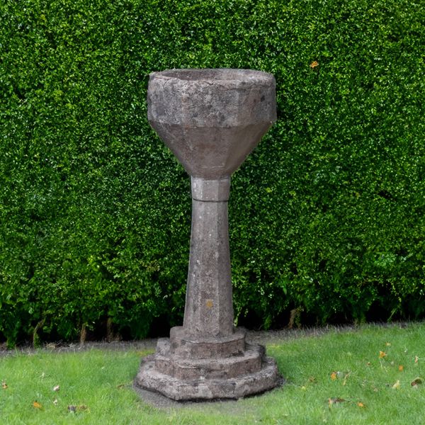 A 16TH CENTURY STONE OCTAGONAL FONT