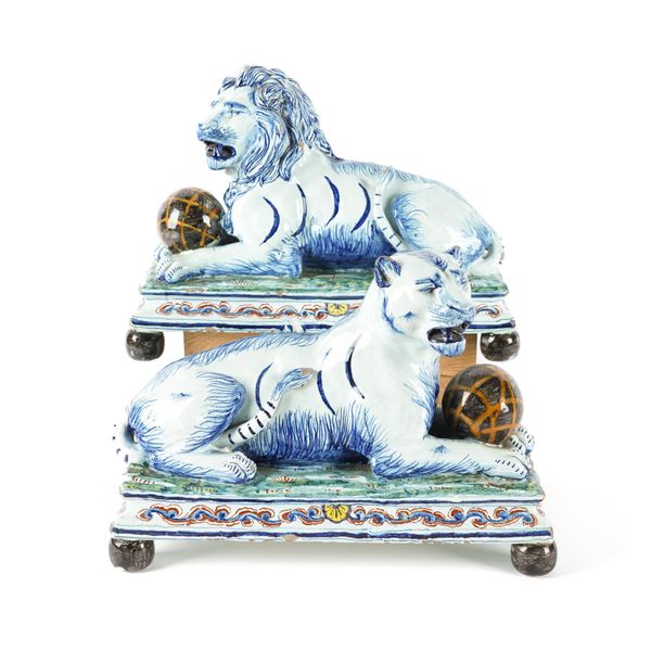 A PAIR OF LARGE DUTCH DELFT MODELS OF A LION AND LIONESS (2)