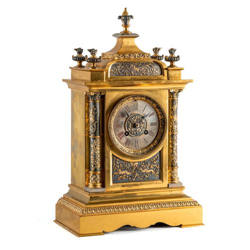 A FRENCH GILT METAL AND PATINATED MANTEL CLOCK