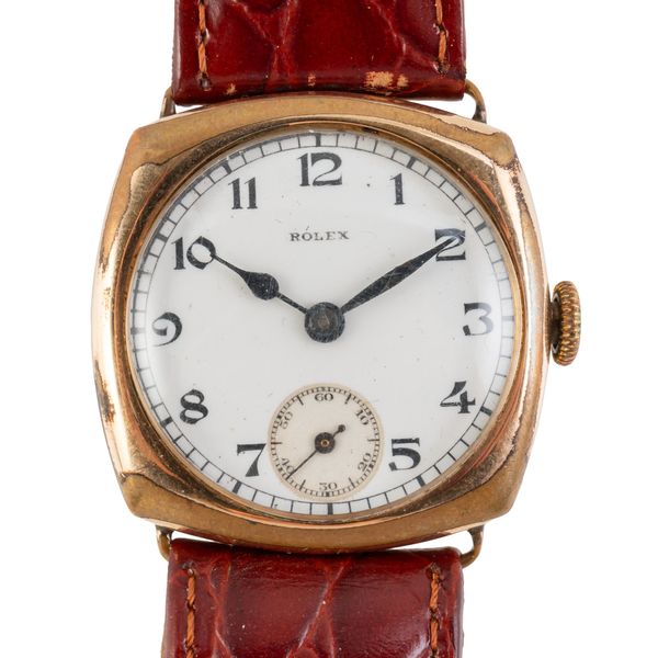 A ROLEX CUSHION SHAPED WATCH 14KT GOLD PLATES