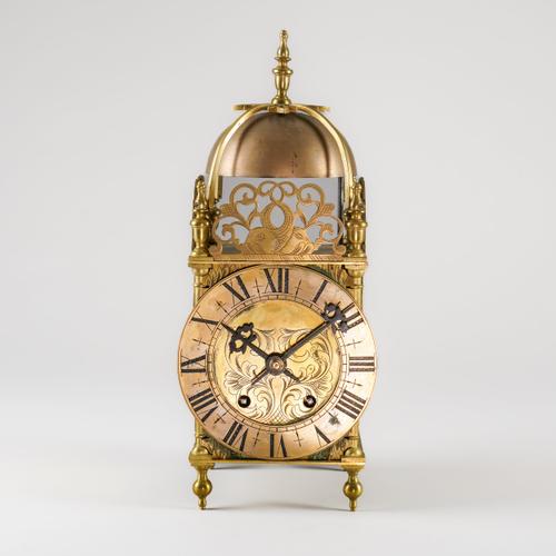 A BRASS LANTERN CLOCK