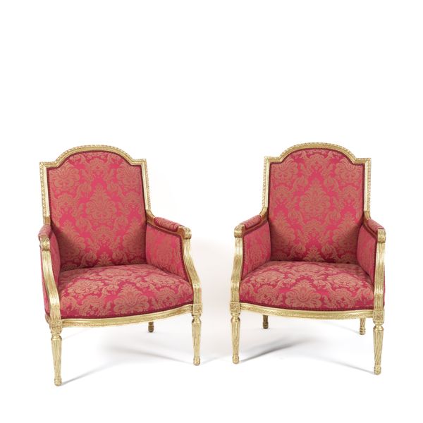 A PAIR OF GILT FRAMED ARCHBACK ARMCHAIRS (2)