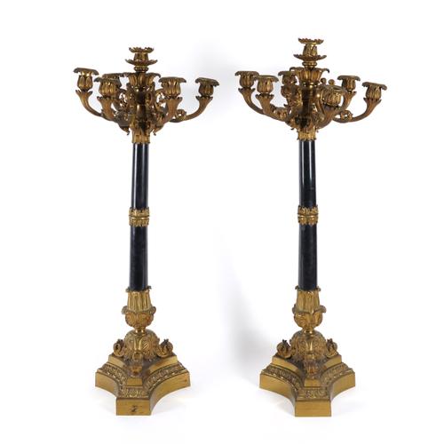 A PAIR OF FRENCH GILT-BRONZE AND BLACK MARBLE MOUNTED SEVEN-LIGHT CANDELABRA (2)
